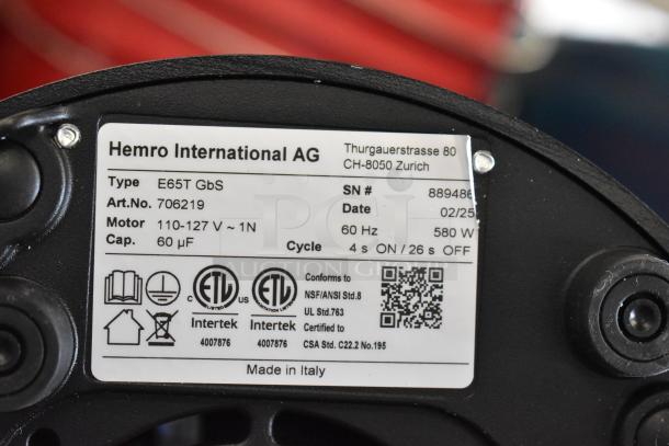 Label on Mahlkonig E65T grinder displays specifications: 110-127V, 60Hz, 580W, 4s ON/26s OFF cycle. Made in Italy.