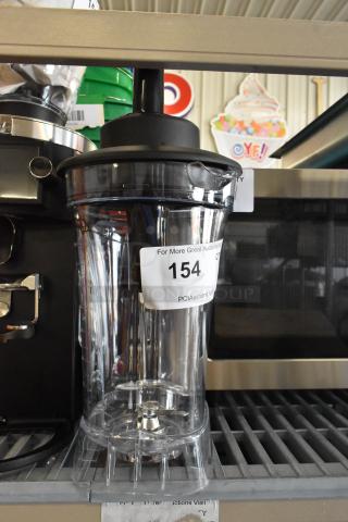 AvaMix Poly Clear Blender Pitcher, brand new with minor scratches. Transparent design, visible blade assembly, auction label 154.