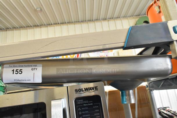 Brand new metal tray for meat grinder, visible scratch, part of scratch and dent sale. Auction label with item number 155.