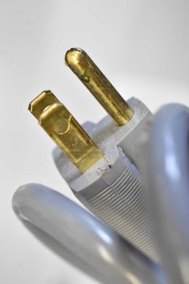 Close-up of the power plug for Edlund 350 Electric Fruit and Vegetable Slicer, showing minor scratches.