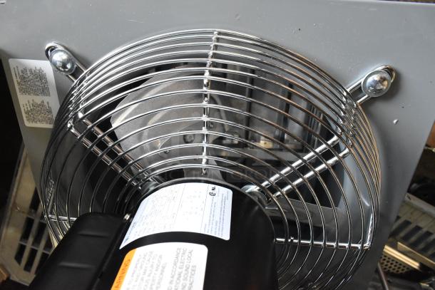 BRAND NEW SCRATCH AND DENT! 2025 Canarm S12-E1 12" wall exhaust fan, 1-speed, 1,640 CFM, 1/4 hp, visible labels detailing specs.