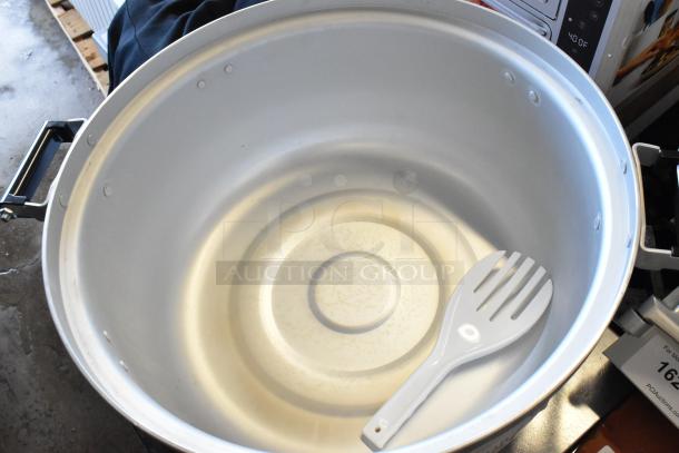 Emperor's Select gas rice cooker, model 478EGRC140LP. New condition, holds 140 cups. Visible handles and serving paddle.