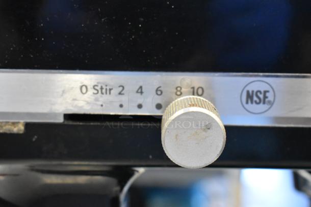 KitchenAid KSM8990OB metal black mixer speed dial, featuring settings 0 to 10 and NSF certification mark. Power cord cut.