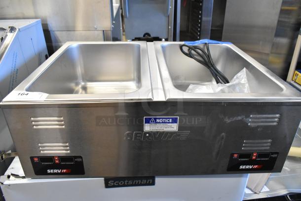 Brand new ServIt 423FW200D stainless steel dual well food warmer, digital controls, slight scratches, 120V, 1 phase.