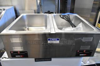 Brand new ServIt 423FW200D stainless steel dual well food warmer, digital controls, slight scratches, 120V, 1 phase.