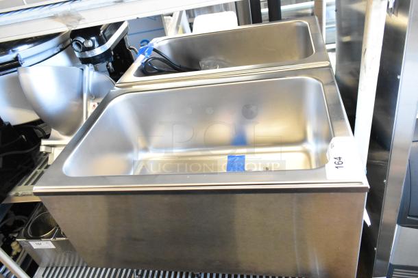 Brand new ServIt 423FW200D stainless steel dual well electric countertop food warmer. Features digital controls.