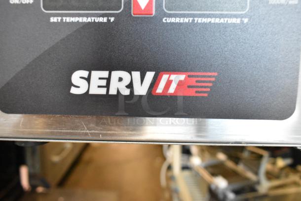 BRAND NEW ServIt 423FW200D stainless steel 12"x20" dual well electric food warmer with digital controls. Visible logo.