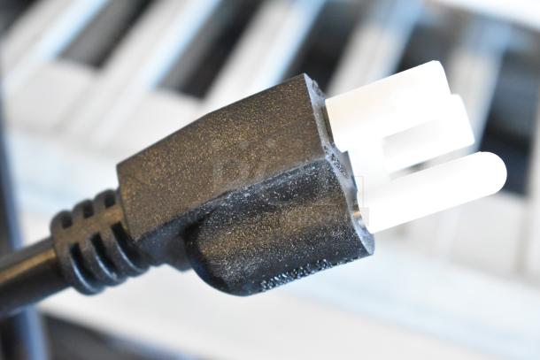 Close-up of a black power plug for the Hatco GRAH-48 48" Glo-Ray Infrared Food Warmer.