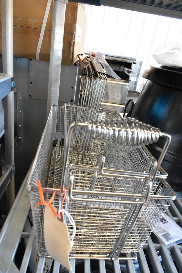 Three brand new fryer basket presses and basket, models 190FBPRSS145, 190FBPRSS104, and 190FB1366, with visible tags.