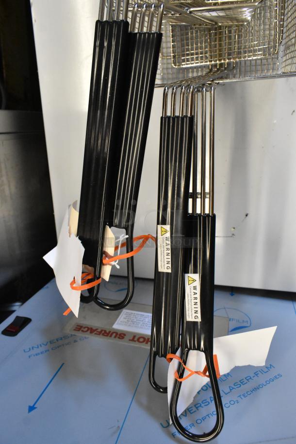 Three new scratch and dent fryer basket presses; sizes 14.5"x6", 10"x4.75", and 13.25"x6.5"x5.875" with front hook.