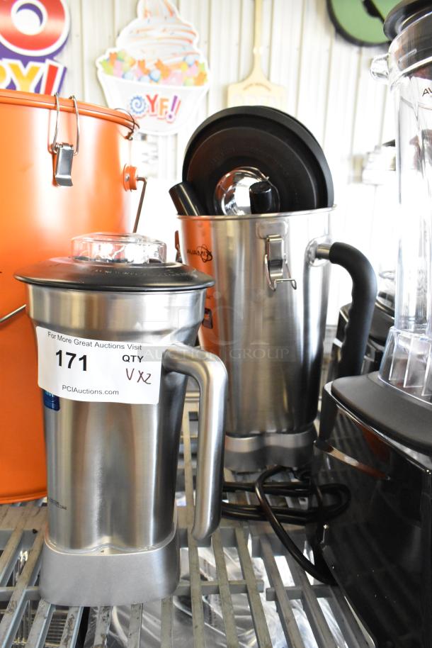Two AvaMix stainless steel blender pitchers, brand new, featuring scratch and dent condition. Labels indicate auction details.