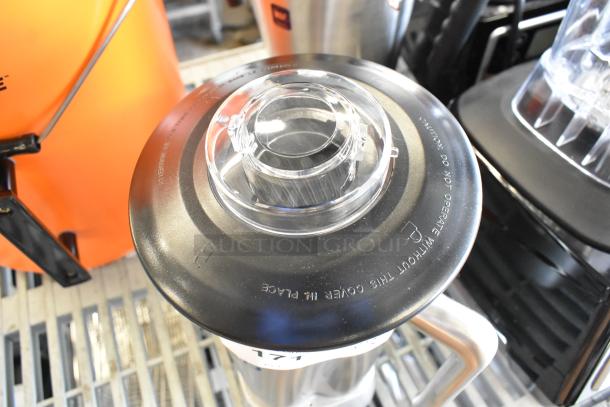 AvaMix stainless steel blender pitcher, brand new, scratch and dent. Durable lid with labeled warnings visible.