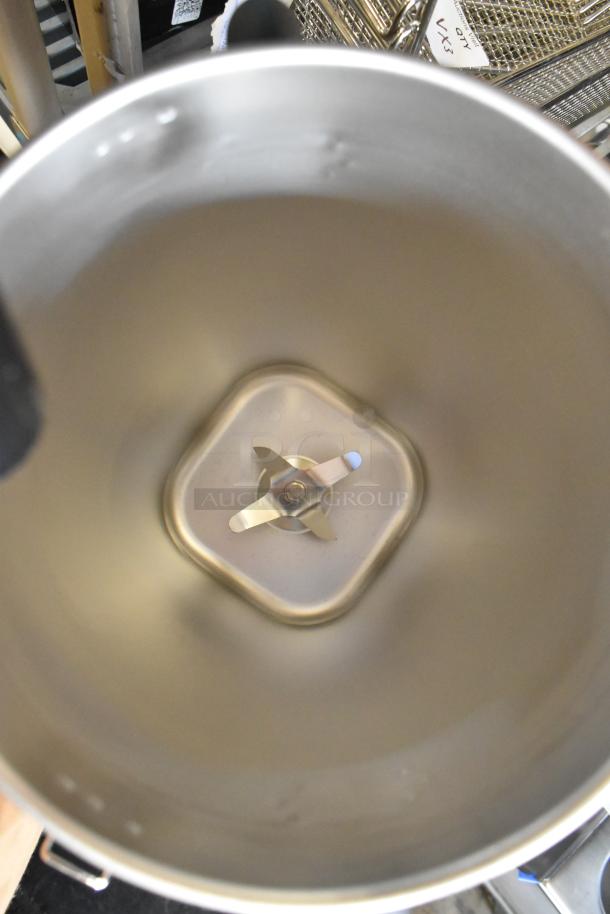 AvaMix stainless steel blender pitcher, brand new, scratch and dent, interior view with blades.