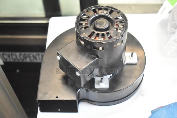 BRAND NEW SCRATCH AND DENT AMI-R23038-3BD00EJ-185 Motor, 115 Volts, 1 Phase, visible casing and mounting hardware.