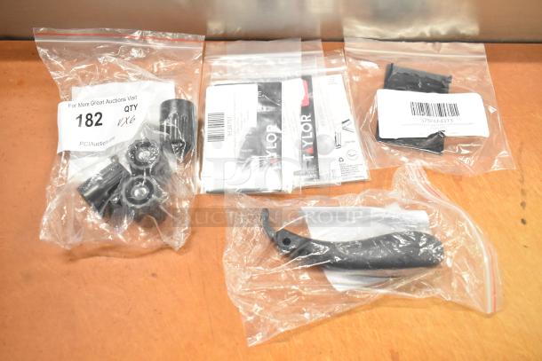 Set of 6 new assorted parts, including Galaxy tap handle and legs for slushy machines, Narvon display support, and Taylor test labels.