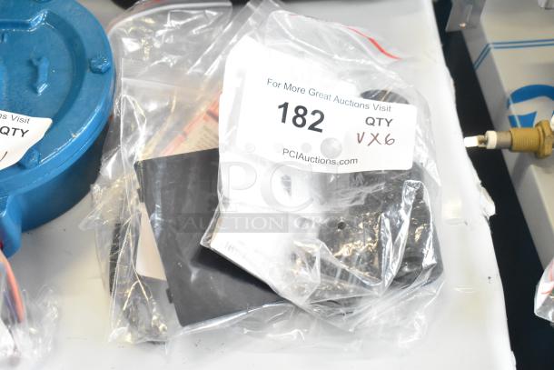 Lot of 6 brand new scratch and dent items in sealed bags. Includes Galaxy tap handle, leg, Narvon display support, Taylor test labels, and strip.