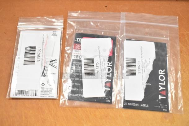 Set of 6 new scratch and dent items, including Galaxy parts and Taylor dishwasher labels, in sealed packaging.