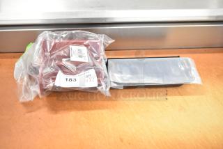 Brand new Robot Coupe 103280S pusher in packaging, labeled as scratch and dent, quantity two.