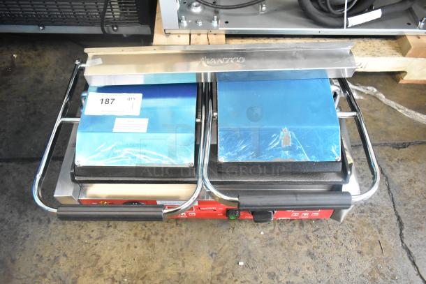 Brand new Avantco 177PG400ST stainless steel dual panini grill, smooth plates, 19 5/8" x 9 1/8" surface, 120V.