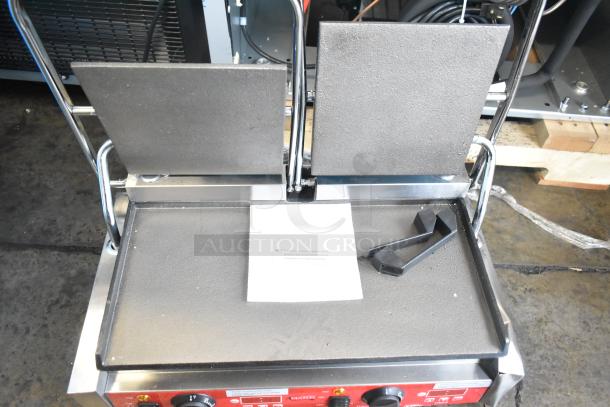 Brand new Avantco 177PG400ST stainless steel panini grill with smooth plates, timer, and 19 5/8" x 9 1/8" surface. 120V.