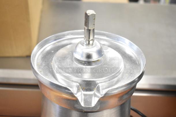 Brand new AvaMix 928CJ1400 electric citrus juicer base in stainless steel, showing minor scratches. 120 volts, 1 phase.