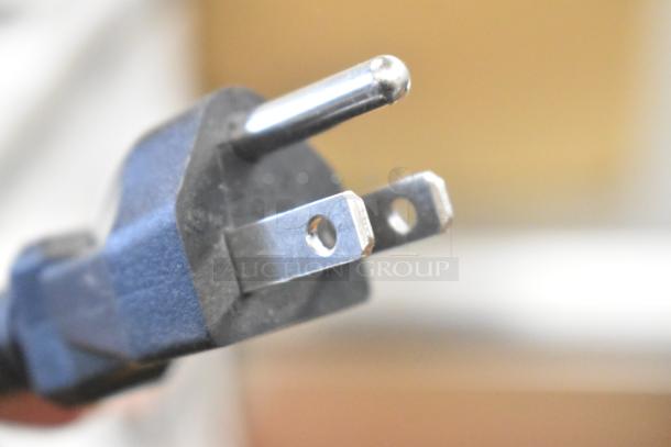 Close-up of a power plug for AvaMix 928CJ1400 citrus juicer, 120V, 1 Phase. Plug shows the prongs in detail.
