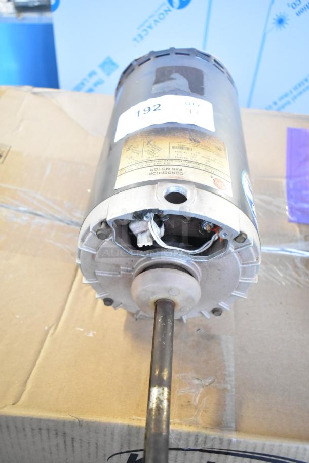 US Motors condenser fan motor, silver, visible wiring, and identification label. Appears in good condition.