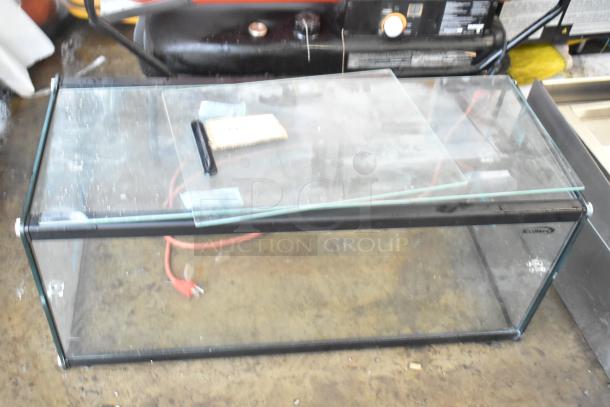 Rectangular glass case with black frame, missing back and bottom panes. Features front and top glass panels.