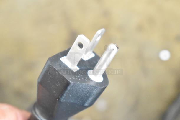 Close-up of a three-prong plug for the 2025 KoolMore KM-CWO30-SS built-in microwave with convection, 120 volts.