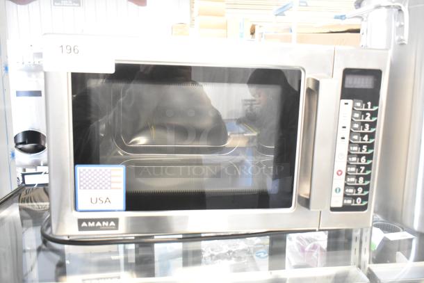 Amana RCS10TS stainless steel commercial countertop microwave oven, 120 volts, excellent condition, keypad controls visible.