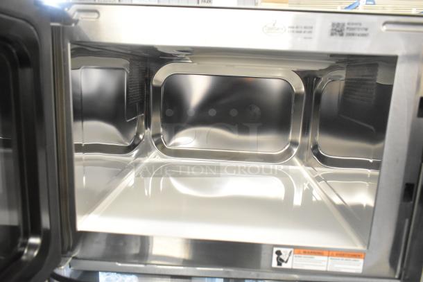 Amana RCS10TS stainless steel commercial microwave, 120V, 1 phase, pristine interior, ideal for countertop use.