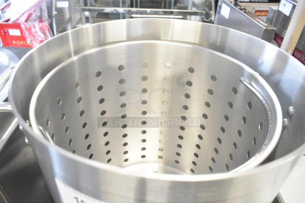 Choice 471GR60QT 60 Qt. aluminum stock pot with steam insert, standard weight, visible perforations, excellent condition.
