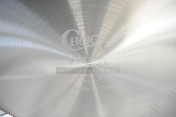 Choice 471GR60QT aluminum stock pot, 60 Qt, with visible brand markings, standard weight, includes steam insert, made in China.