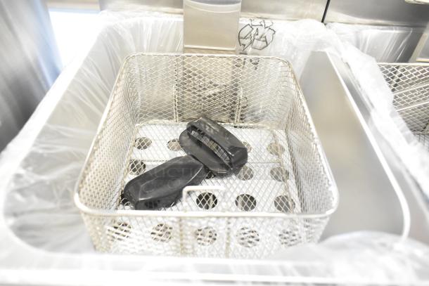 Mainstreet 177F20E dual tank electric fryer, stainless steel, new condition, includes basket and lid, 110V, 1 phase.