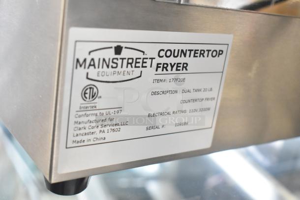 Stainless steel Mainstreet 177F20E countertop fryer with dual tanks, 20 lb capacity, 110V, includes two metal baskets and lids.