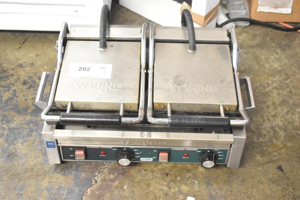 Waring WFG300 stainless steel double panini press, commercial countertop model, 240V, 1 phase, visible controls, used condition.
