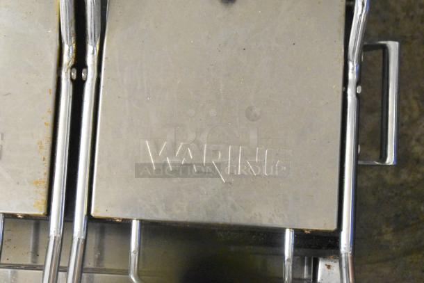 Waring WFG300 stainless steel commercial double panini press with visible branding. 240 volts, 1 phase.