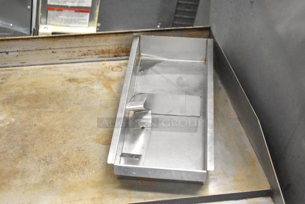 Patriot stainless steel countertop gas flat top griddle, used condition, commercial-grade, visible wear on the surface.