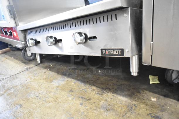 Patriot stainless steel gas countertop griddle, three control knobs, commercial use, good condition, brand logo visible.