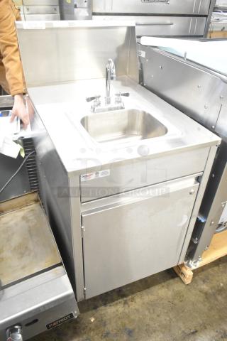 QualServ stainless steel portable sink on commercial casters, with faucet and cabinet. 120 volts, 1 phase, excellent condition.