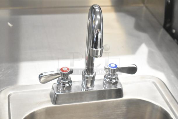 QualServ stainless steel portable sink with faucet, dual handles, and commercial casters. 120V, 1 phase. Excellent condition.