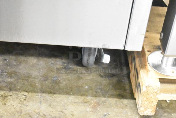 QualServ stainless steel portable sink with commercial casters, 120V, 1 phase, on a pallet. Durable design, ideal for commercial use.