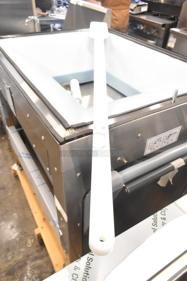 BRAND NEW Follett LQ1BASE stainless steel ice machine stand with poly ice bin; minor scratches and dents visible.