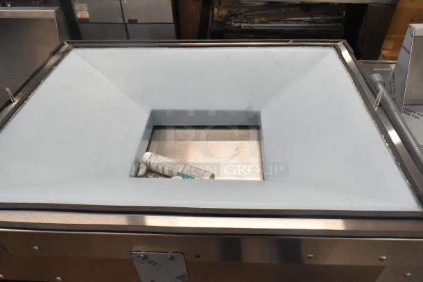 BRAND NEW Follett LQ1BASE stainless steel ice machine stand with poly ice bin, minor scratches visible.