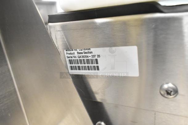 BRAND NEW Follett LQ1BASE stainless steel ice machine stand with poly ice bin. Scratch and dent condition. Model label visible.