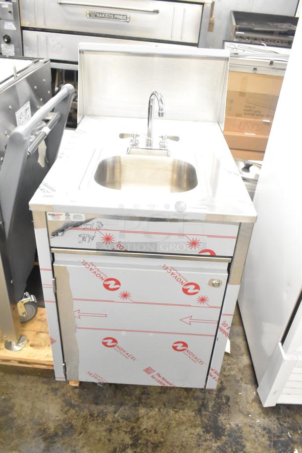 Brand new QualServ stainless steel portable sink, scratch and dent condition, on commercial casters, 120V, 1 Phase.