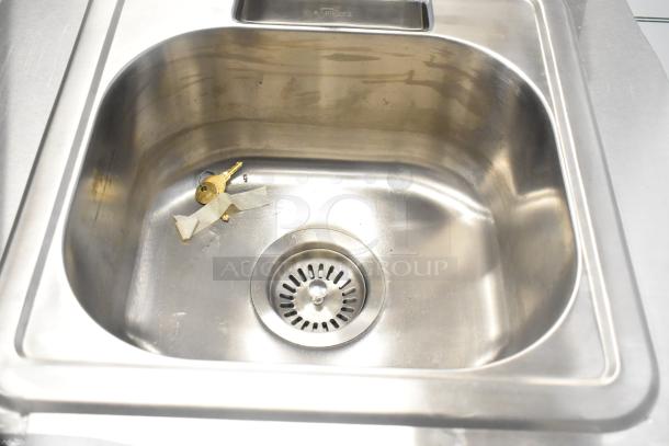 QualServ stainless steel portable sink with commercial casters. New, with minor scratches. Includes keys. 120V, 1 Phase.