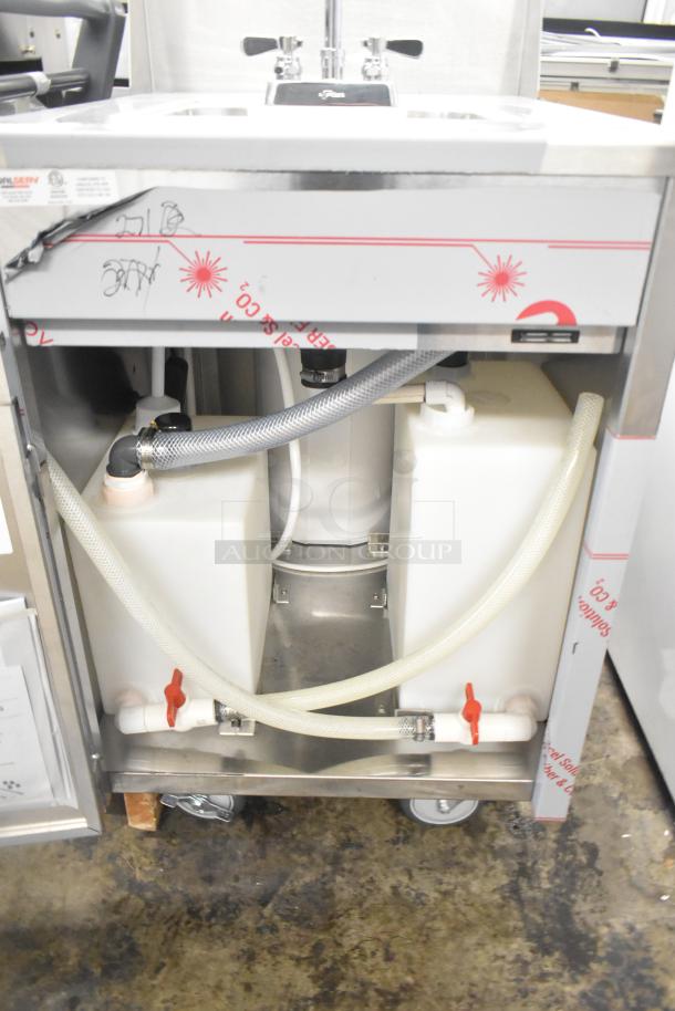 QualServ stainless steel commercial portable sink, scratch and dent, 120V, 1 phase, on casters, with water tanks and hoses.