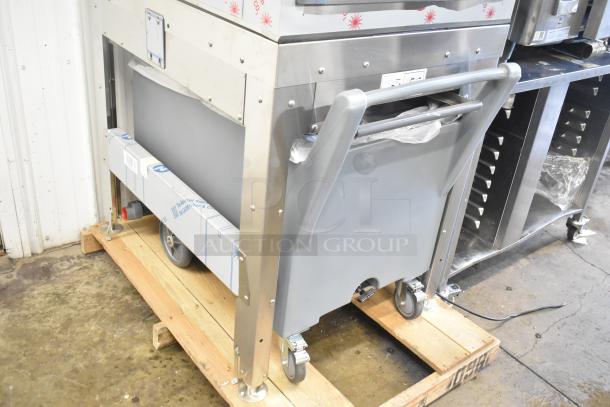 Brand new 2024 Scotsman FS1222A-32B stainless steel ice head on 2025 Scotsman ICS730-A bin, with Follett stand and gray ice cart.