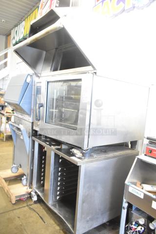 2019 Rational SCC WE 62 Self Cooking Center Stainless Steel Commercial Combi Convection Oven w/ 2019 Rational 60.74.979 UltraVent Plus Recirculating Condensation Hood on Double Pan Rack Equipment Stand. Door Does Not Stay Closed. 480 Volts, 3 Phase. - Item #1226867